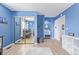 Bright blue Bedroom bedroom with a crib, changing table, and ample storage space with laminate flooring at 4808 S Ward Way, Morrison, CO 80465