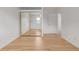 Bright bedroom featuring wood floors, a large mirrored closet, and a sun-filled window at 4808 S Ward Way, Morrison, CO 80465