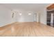 Spacious bedroom featuring light hardwood floors, natural light and an ensuite bathroom at 4808 S Ward Way, Morrison, CO 80465
