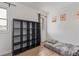 Bright bedroom featuring wood floors, neutral walls, and natural light at 4808 S Ward Way, Morrison, CO 80465