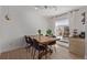 Bright dining area features a large window, modern lighting, and wood floors at 4808 S Ward Way, Morrison, CO 80465