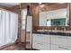 Charming en suite bathroom with mosaic tile, double vanity, and shower at 4808 S Ward Way, Morrison, CO 80465
