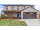 Attractive two-story home boasting a charming front porch, inviting curb appeal, and a two-car garage at 4808 S Ward Way, Morrison, CO 80465
