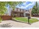 Inviting two-story home showcasing a welcoming front porch, green lawn, and an attached two-car garage at 4808 S Ward Way, Morrison, CO 80465