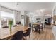Open concept kitchen and dining area features stainless steel appliances and modern cabinetry at 4808 S Ward Way, Morrison, CO 80465