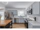 Modern kitchen features stainless appliances, light colored cabinets, and ample counter space for cooking and entertaining at 4808 S Ward Way, Morrison, CO 80465