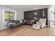Stylish living room featuring a black accent wall, contemporary furniture, and natural light at 4808 S Ward Way, Morrison, CO 80465
