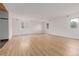 Spacious living room with light walls, recessed lighting, and wood floors at 4808 S Ward Way, Morrison, CO 80465
