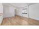 Bright room with new floors and neutral paint shows entry and large window offering a blank canvas at 4808 S Ward Way, Morrison, CO 80465