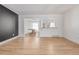 Open-concept living area with wood floors and ample natural light at 4808 S Ward Way, Morrison, CO 80465