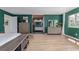 Large main bedroom with wood floors leading to an en suite bathroom and closet at 4808 S Ward Way, Morrison, CO 80465