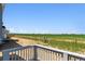 View of the backyard with fence and natural grass at 1281 Loraine N Cir, Lafayette, CO 80026