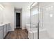 A modern bathroom features a glass-enclosed shower, soaking tub, and double sink vanity at 1281 Loraine N Cir, Lafayette, CO 80026
