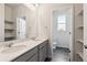 Bathroom featuring double sinks, plenty of counterspace, and wood look flooring at 1281 Loraine N Cir, Lafayette, CO 80026