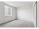 Bedroom featuring a large window for natural light and a closet with sliding doors at 1281 Loraine N Cir, Lafayette, CO 80026