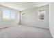 A bright bedroom offers a neutral carpet, ample natural light, and sizable windows at 1281 Loraine N Cir, Lafayette, CO 80026