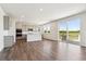 Open concept kitchen with stainless appliances, island, and access to the outdoor patio with expansive views at 1281 Loraine N Cir, Lafayette, CO 80026