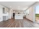 Open concept kitchen with stainless appliances, island, and access to the outdoor patio with expansive views at 1281 Loraine N Cir, Lafayette, CO 80026