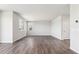 A spacious living room is bright with natural light and features dark, sleek hardwood flooring at 1281 Loraine N Cir, Lafayette, CO 80026