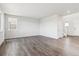 An expansive living room with sleek, hardwood flooring and natural light offers generous space at 1281 Loraine N Cir, Lafayette, CO 80026