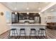 Modern kitchen with stainless steel appliances, granite countertops, and a center island with barstool seating at 11933 Norfolk Ct, Commerce City, CO 80022