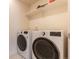 Convenient laundry room featuring modern, front-loading washer and dryer units at 11933 Norfolk Ct, Commerce City, CO 80022