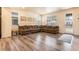 Spacious living room features new flooring, lots of natural light, and comfortable seating at 11933 Norfolk Ct, Commerce City, CO 80022