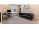 Comfortable and bright office space with modern desk, chair, sofa and window view at 11933 Norfolk Ct, Commerce City, CO 80022