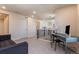 Bright, open upstairs office area with desk, chair, and comfortable seating area at 11933 Norfolk Ct, Commerce City, CO 80022