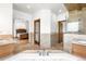 Luxurious bathroom with dual sinks, granite counters, and a glass-enclosed shower at 1195 W 70Th Ave, Denver, CO 80221