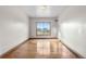 Spacious bedroom featuring hardwood floors and a bright window offering natural light at 1195 W 70Th Ave, Denver, CO 80221