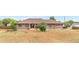 Charming single-story brick home with well-maintained lawn and inviting front porch on a sunny day at 1195 W 70Th Ave, Denver, CO 80221