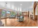 Expansive living area featuring hardwood floors, abundant natural light, and an open layout at 1195 W 70Th Ave, Denver, CO 80221