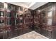 Individual wine lockers with glass doors and wood cabinets in the wine cellar at 1827 N Grant St # 1104, Denver, CO 80203