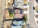 Birds eye view of a house with solar panels and landscaped yard in a residential neighborhood at 8815 W Quarto Cir, Littleton, CO 80128