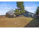 Large backyard features a spacious lawn and a relaxing gazebo area at 8815 W Quarto Cir, Littleton, CO 80128
