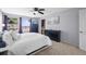 Serene bedroom with plush carpeting, ample closet space, and large windows at 8815 W Quarto Cir, Littleton, CO 80128