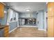 Bright dining area with large windows and access to additional living space at 8815 W Quarto Cir, Littleton, CO 80128