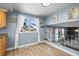 Bright dining area features large windows and views of the living room below at 8815 W Quarto Cir, Littleton, CO 80128