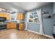 Modern kitchen with a view of the outdoors through a large window at 8815 W Quarto Cir, Littleton, CO 80128