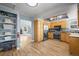 Updated kitchen features modern appliances, wood cabinets, and ample counter space at 8815 W Quarto Cir, Littleton, CO 80128