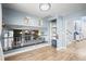 The upstairs loft is open and spacious, with a view to the floor below at 8815 W Quarto Cir, Littleton, CO 80128