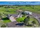 Expansive aerial view of a home on acreage with a large garage or workshop building and mature trees at 1166 Belgian Trl, Elizabeth, CO 80107