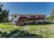 Rear exterior view of a home featuring a large deck, perfect for outdoor relaxation at 1166 Belgian Trl, Elizabeth, CO 80107