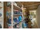 Basement storage area with multiple shelves and storage for tools and automotive fluids at 1166 Belgian Trl, Elizabeth, CO 80107