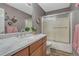 Bathroom showcasing a vanity with a marble countertop and a glass-enclosed shower at 1166 Belgian Trl, Elizabeth, CO 80107
