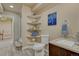 Bathroom featuring a corner shelf, a toilet, and a sink at 1166 Belgian Trl, Elizabeth, CO 80107