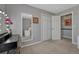 Bedroom area featuring a vanity, a mirror, closet, and doorway to the en suite bathroom at 1166 Belgian Trl, Elizabeth, CO 80107