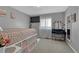 Bedroom featuring neutral paint, plush carpet, and large windows at 1166 Belgian Trl, Elizabeth, CO 80107