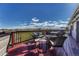 Outdoor deck with fire pit, seating and views at 1166 Belgian Trl, Elizabeth, CO 80107